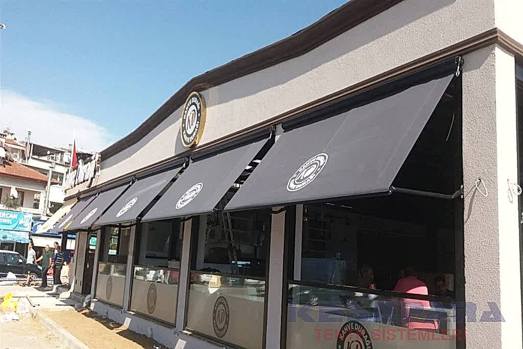 Dış cepheye uygulanan açık bej renkli win tente sistemi